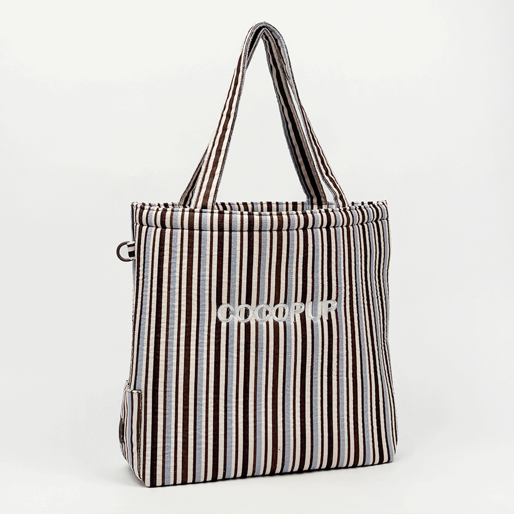 Brown, white and blue striped Tote Bag with poop bag dispenser and D-Ring on side.