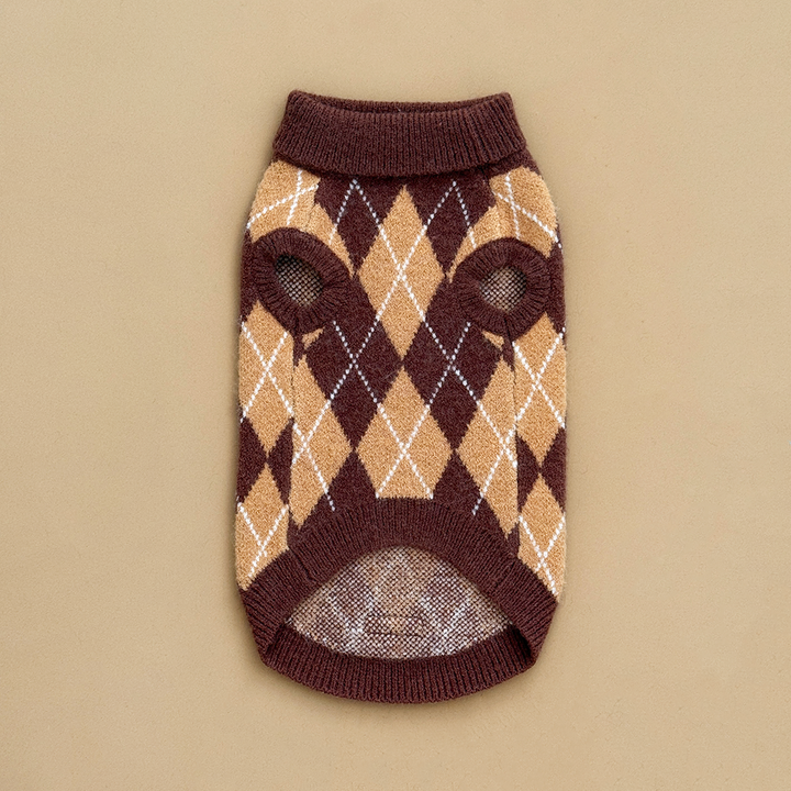 Reverse side of a dog jumper in a brown, tan, and white argyle pattern. 