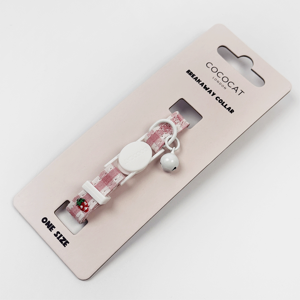 Pink gingham cat collar with breakaway buckle, small bell, and a strawberry-shaped charm.