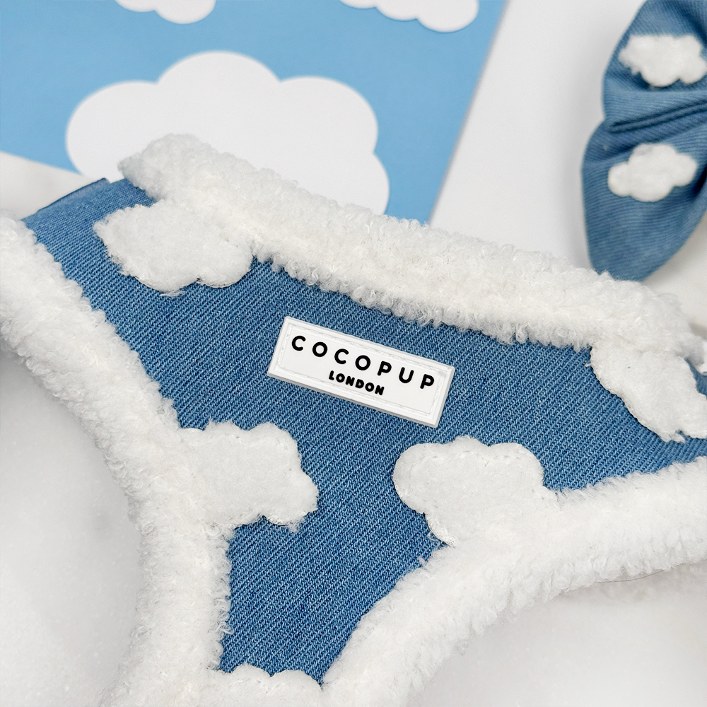 Blue fabric with white clouds and a 'Cocopup London' label on a white background