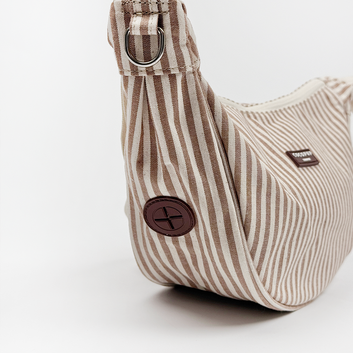 Brown and beige striped Dog Walking Bag with poop bag dispenser.