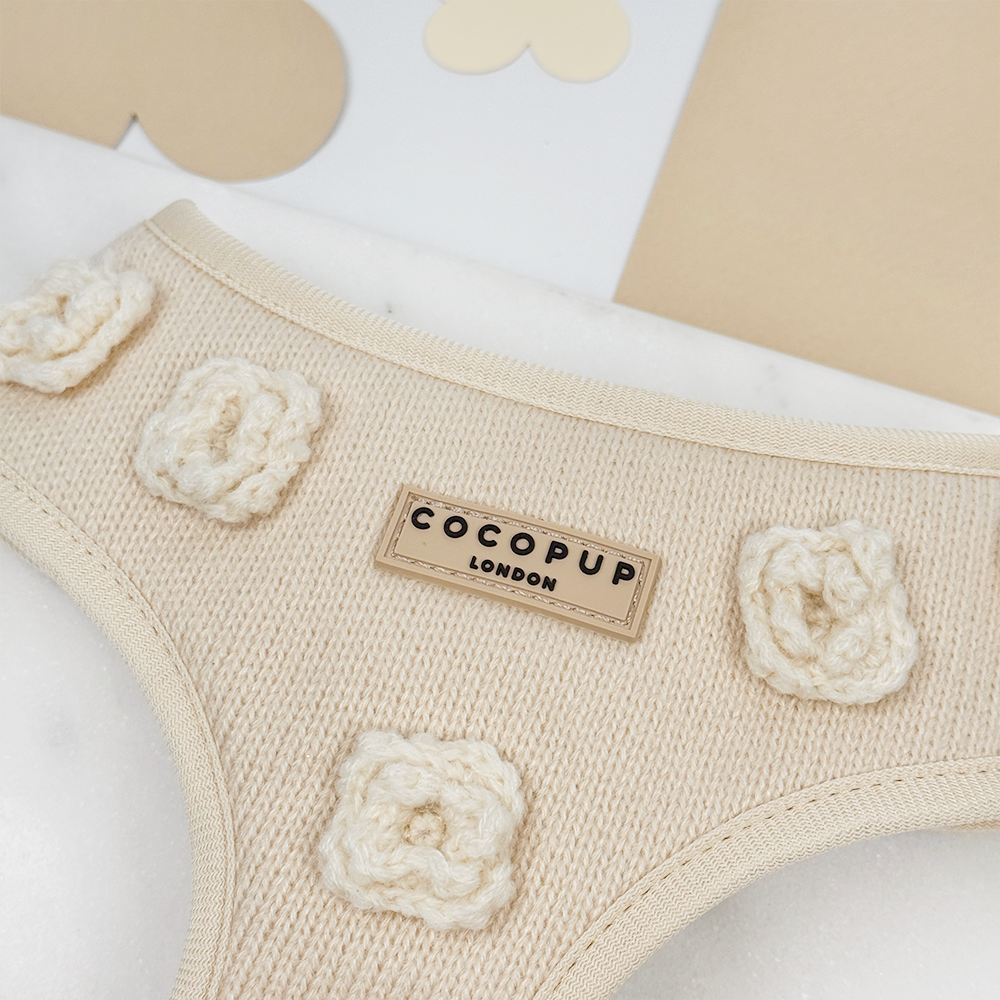 Beige knitted Dog Harness with Cocopup Logo, featuring knitted flowers.