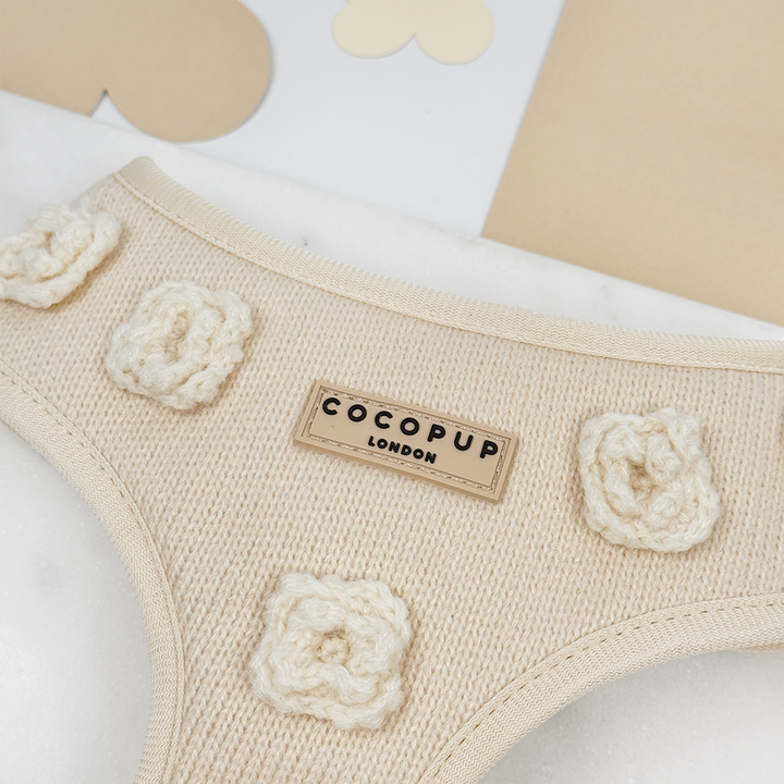 Beige knitted Dog Harness with Cocopup Logo, featuring knitted flowers.